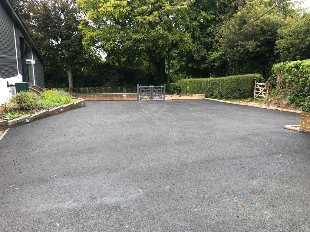 This is a photo of a bitumen driveway which is in the process of being installed by Canberra Road Tek